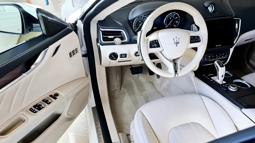 Spotless cream leather Maserati cabin after an interior detail